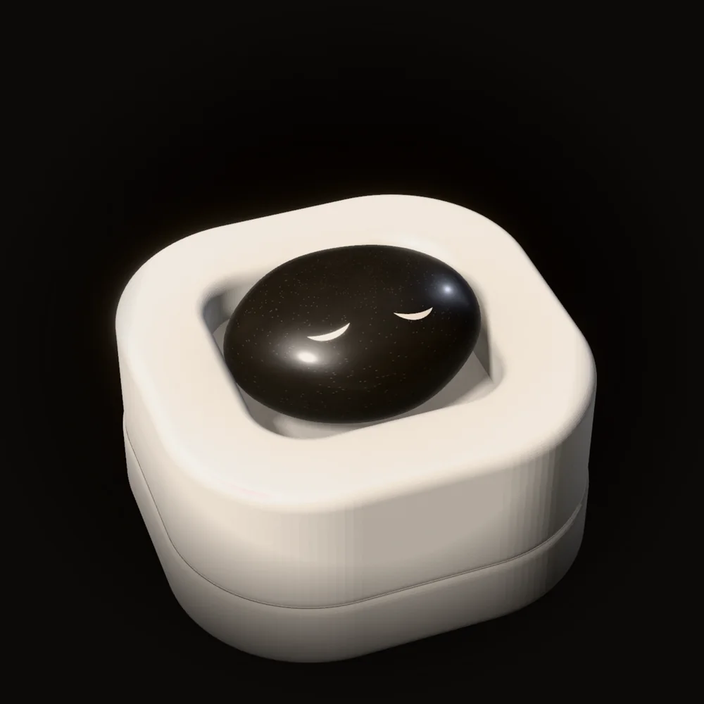 Nap, a basalt stone with closed eyes, in an empty tray of one